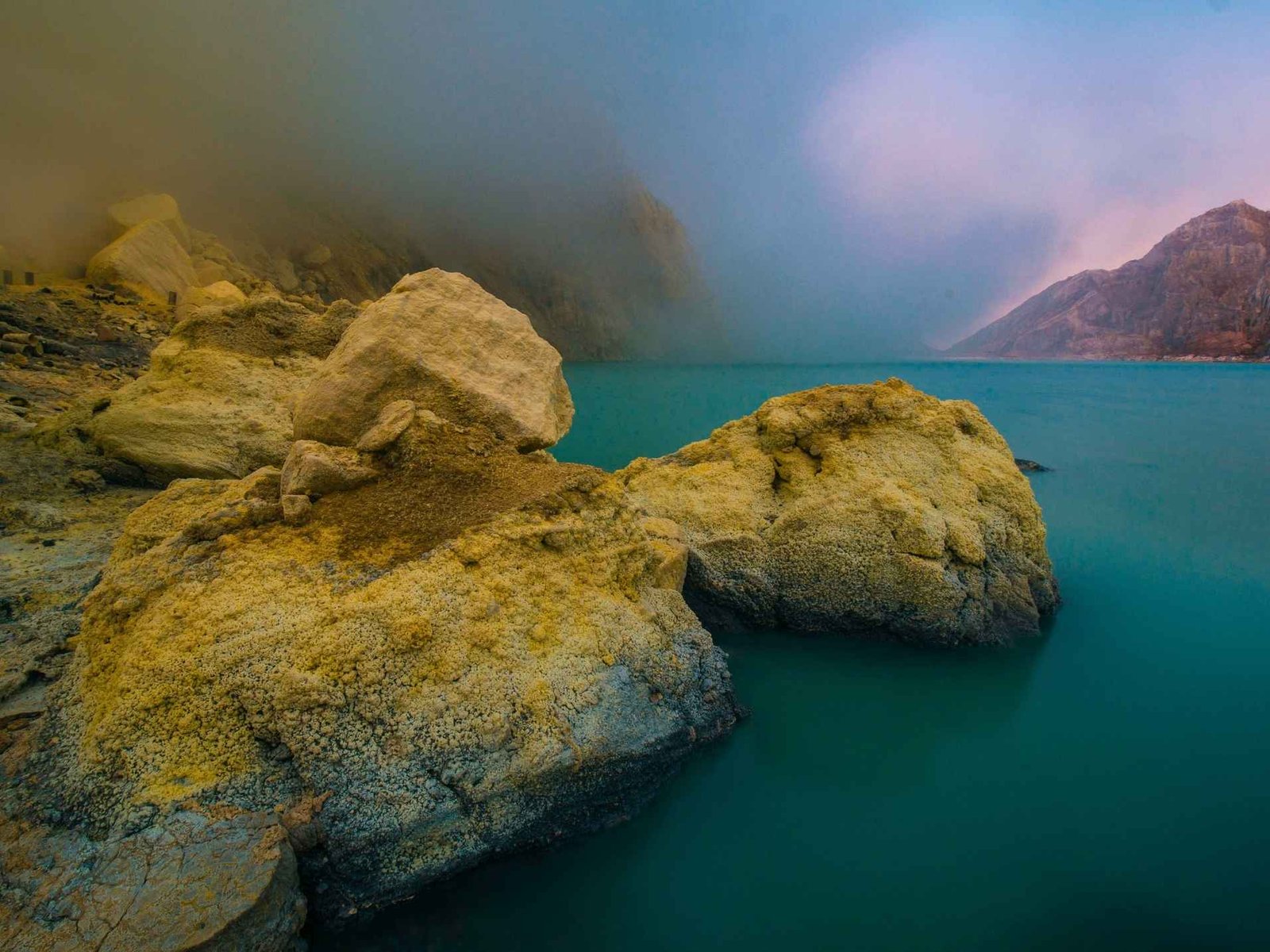 Turquoise acidic crater lake at Ijen Volcano in East Java