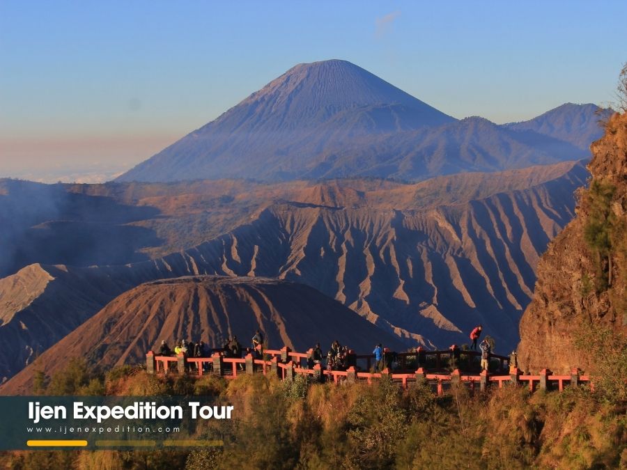 Travelers preparing for cold weather during Mount Bromo sunrise tour