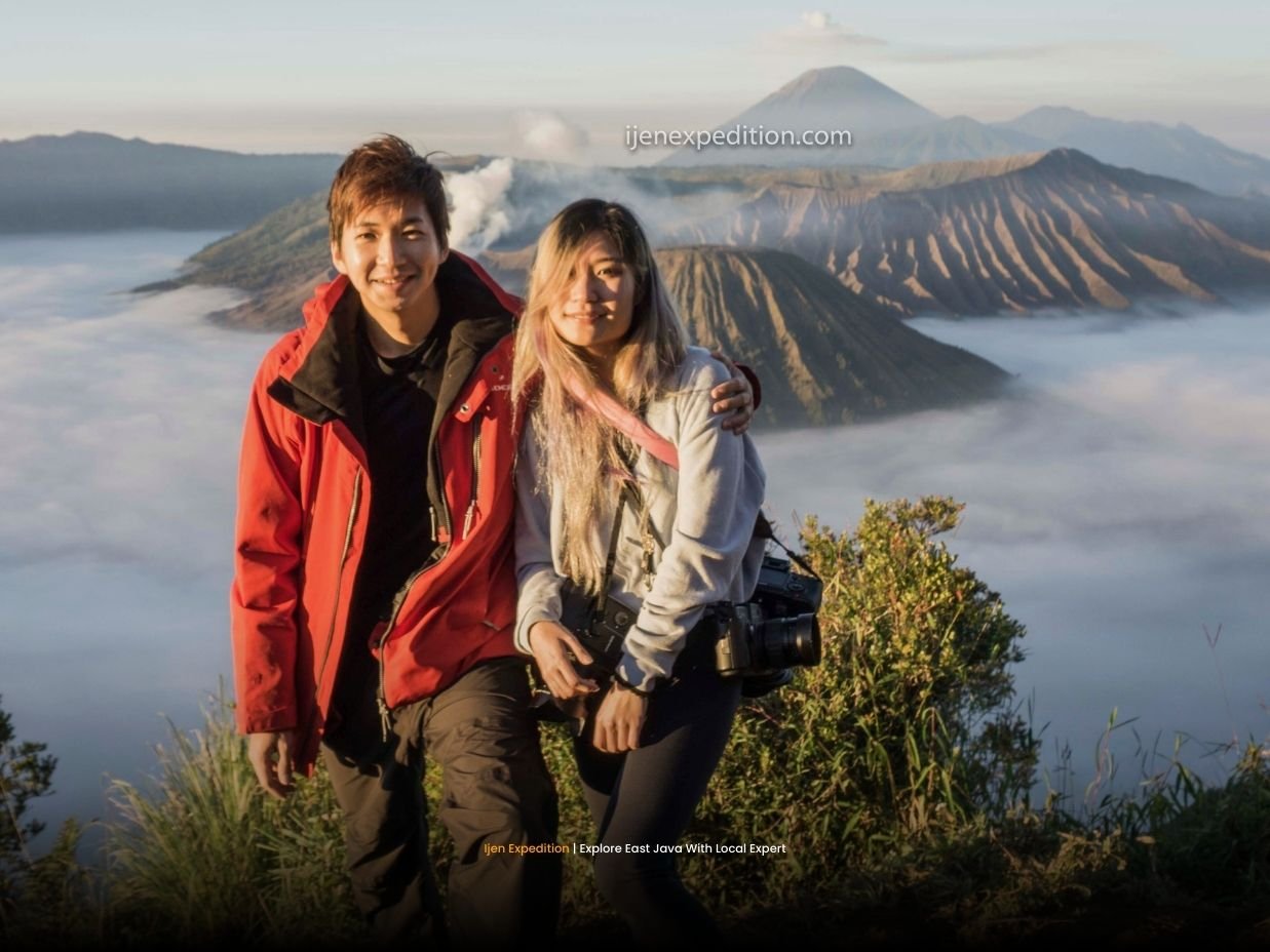 Travelers enjoying a calm view over Mount Bromo caldera