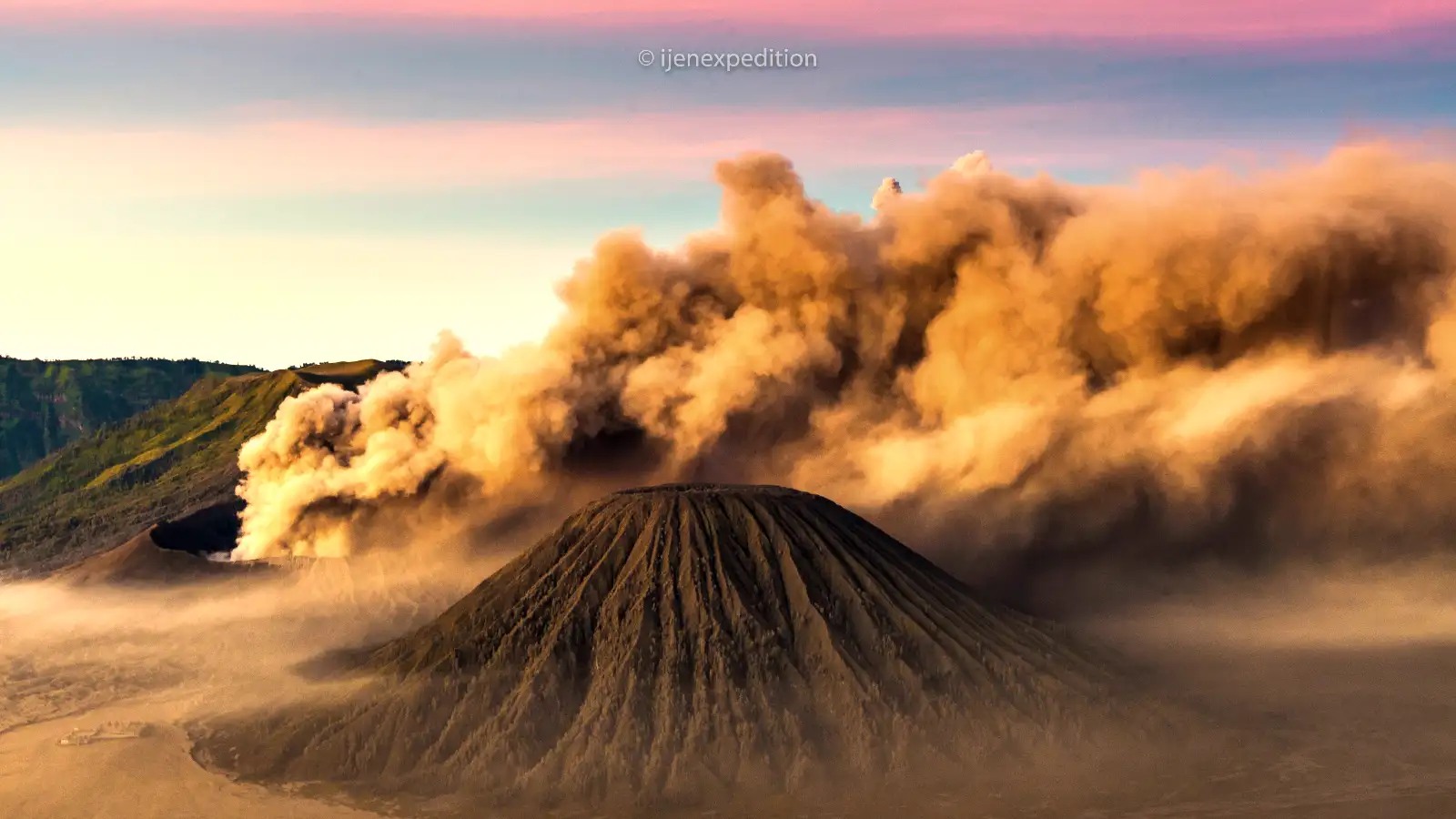 Mount Bromo sunrise tour 2026 panoramic view of the active volcano and Sea of Sand at dawn